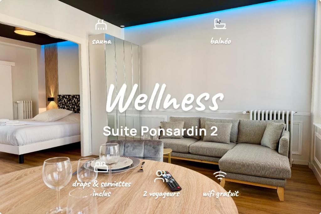 a sign for a hotel room with a couch and a table at Wellness Suite Ponsardin 2 - Reims Centre in Reims