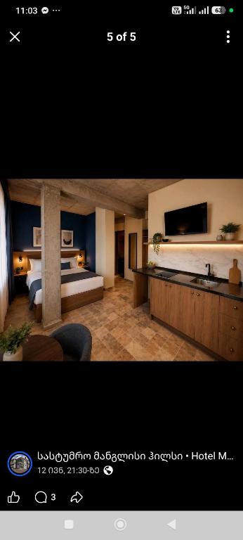 a picture of a hotel room with a bedroom at Hotel Manglisi Hills in Manglisi
