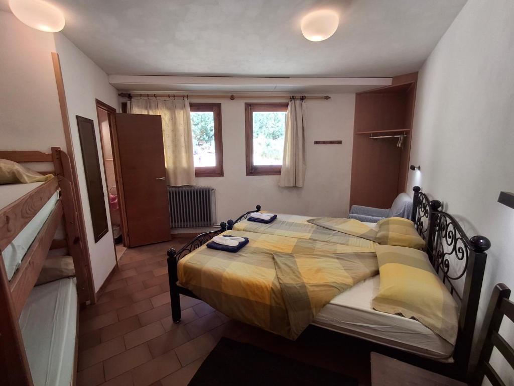a bedroom with a large bed in a room at Setcases-Vallter Hostal Mitja Pensió 5 in Setcases