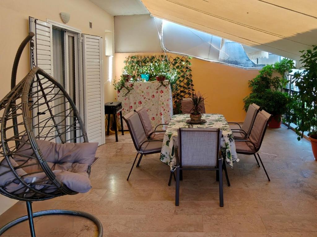 a living room with a table and chairs and a table and chairsktop at Vivari apartment in Vivari