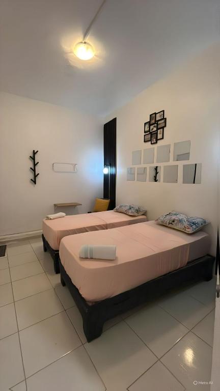 a room with two beds in a room at Twin Bed Room-King Room Zona Colonial in Santo Domingo