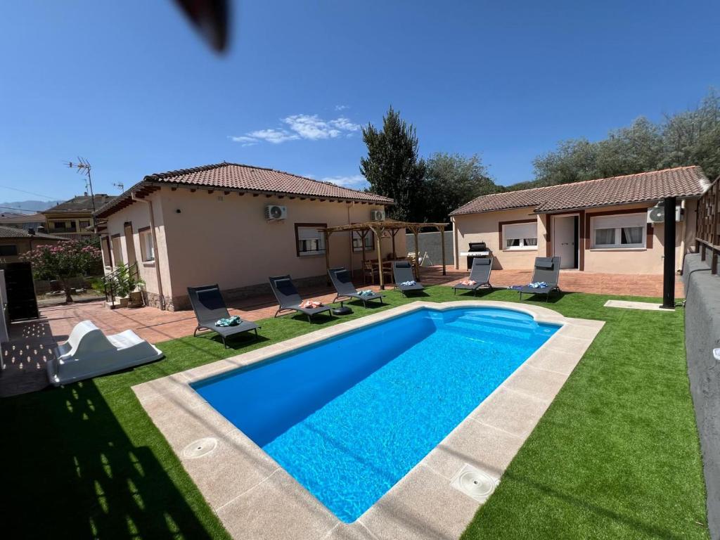 a swimming pool in the backyard of a house at TAYP LaParra Homes in La Parra