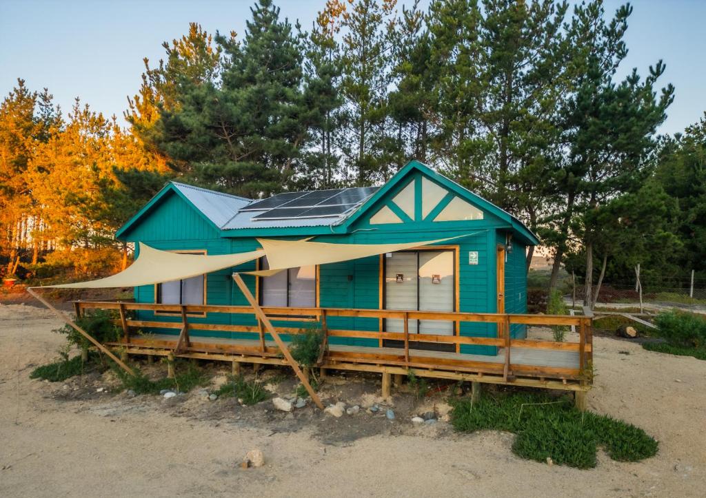 a tiny house with solar panels on it at Cabañas Isla del Mar in Constitución