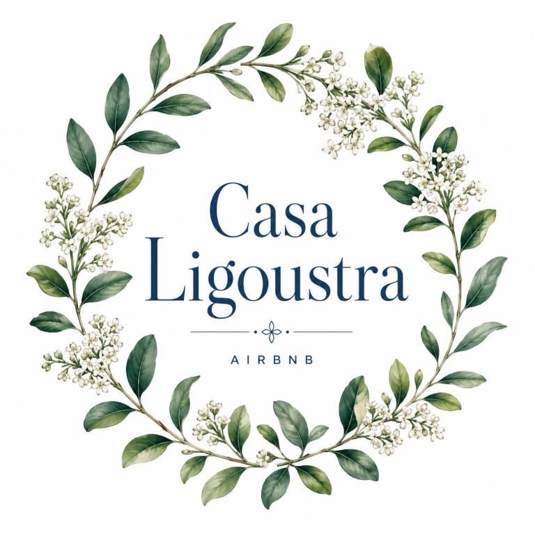 a wreath of flowers and leaves in a circle on a white background at Casa Ligoustra in Kalithies