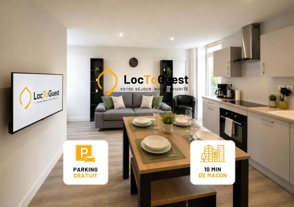 a kitchen and a living room with a table and a couch at Appart'Hôtel Entre les 2 Roches in Prissé