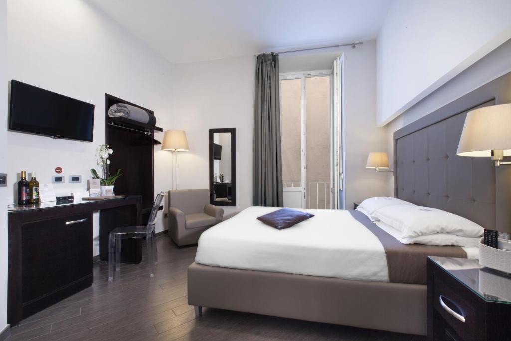 A bed or beds in a room at Magi House Relais