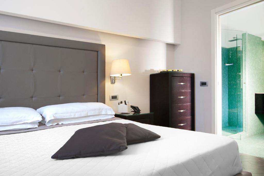 A bed or beds in a room at Magi House Relais