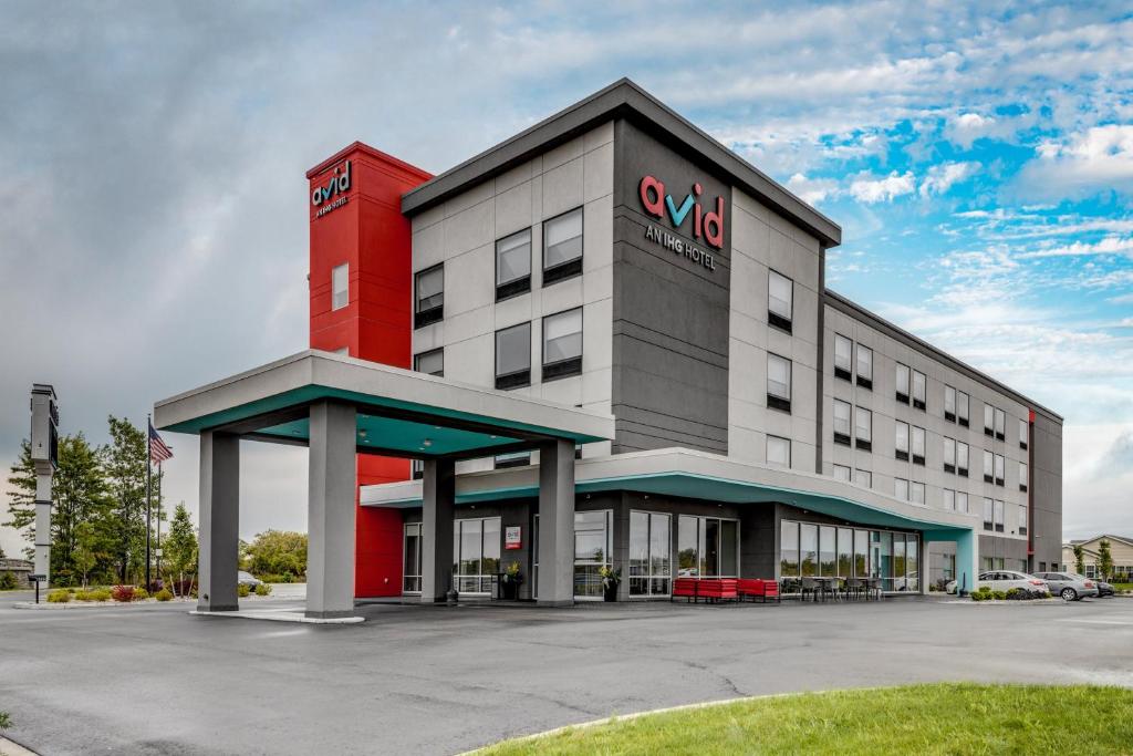 a hotel with a red and gray building at avid hotel Zeeland - Holland by IHG in Holland