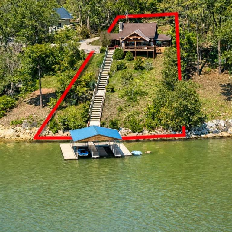 an aerial view of a house on a lake at Ultimate Lake Norris Getaway with Private Dock in New Tazewell