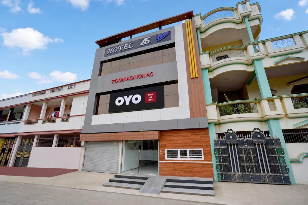 a building with an ovo sign on it at Hotel O A5 Blue in Gorakhpur