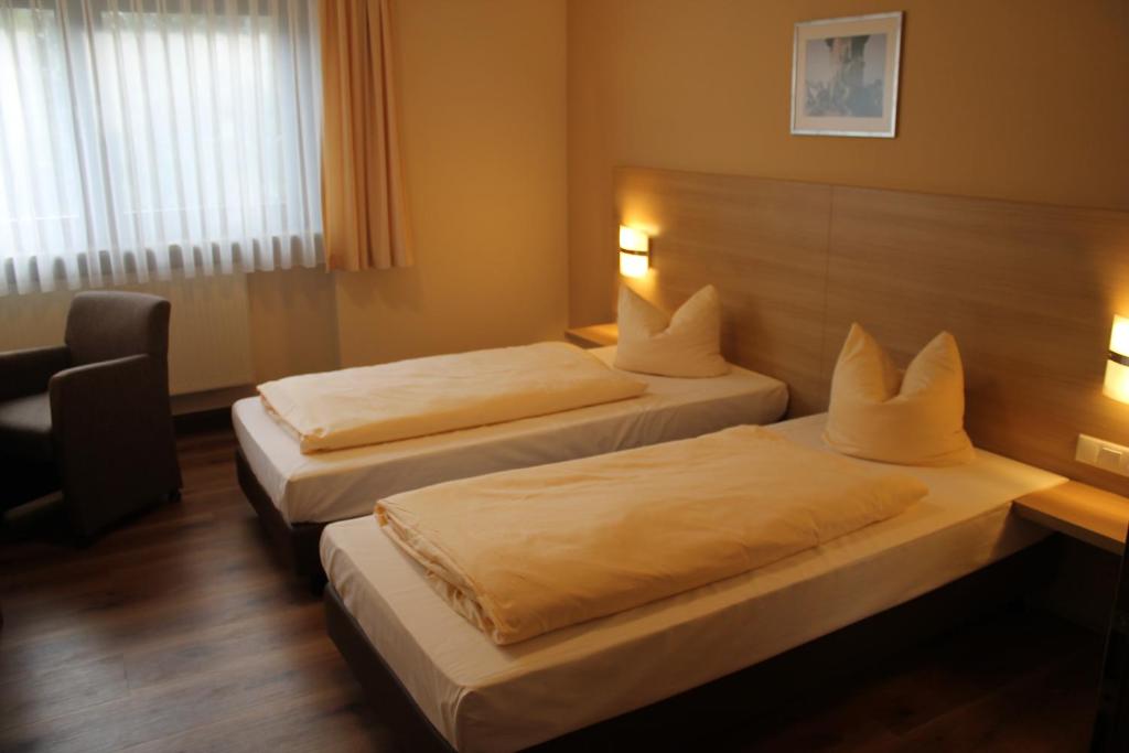 Postel nebo postele na pokoji v ubytování Hotel-Restaurant Stern