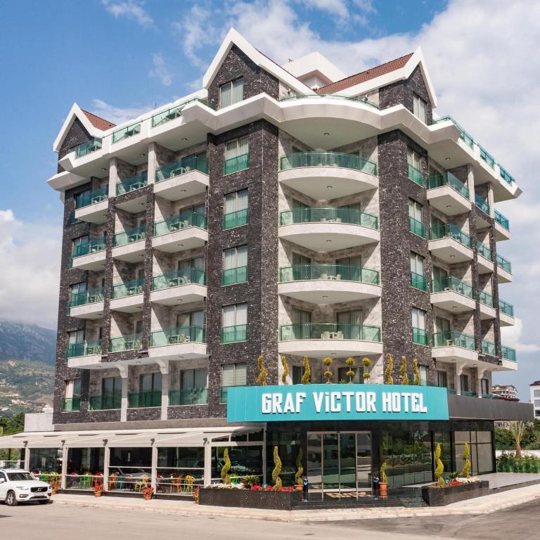 a large building with a sign for a star visitor hotel at Graf Victor Hotel - All Inclusive Non Alcoholic Drinks in Çamyolu