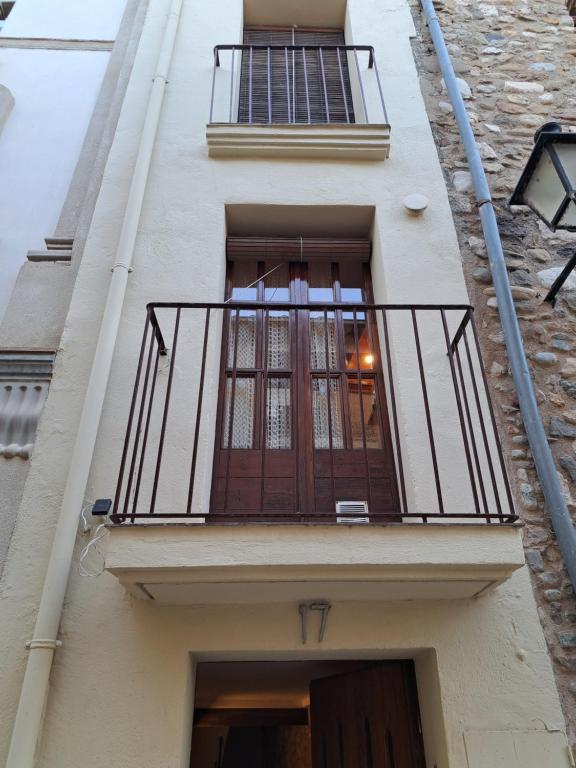 a balcony on the side of a building at Can Teixidor in Besalú