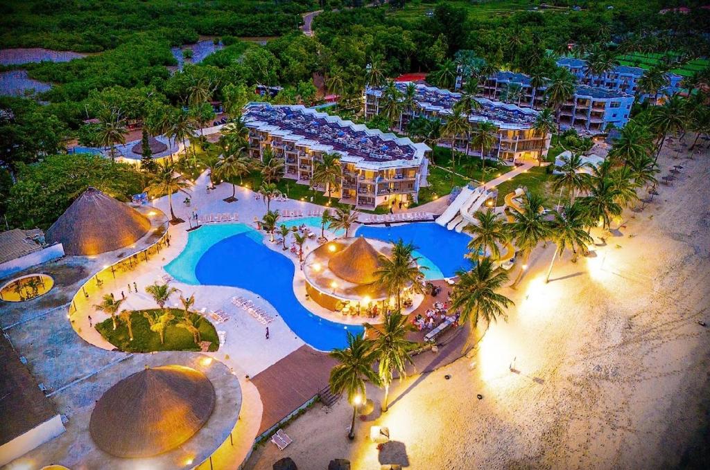 an aerial view of a resort with a swimming pool at m hadji premium in Dakar