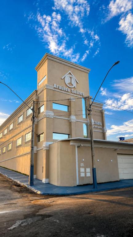 a building with a sign on the side of it at Hotel kitnet Digital in Passos
