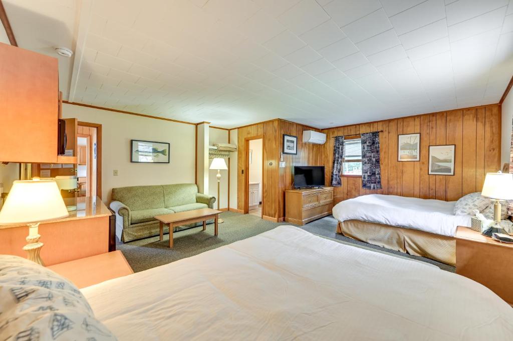 a hotel room with two beds and a television at Dock, Direct Waterfront: Lake Champlain Studio in Willsboro
