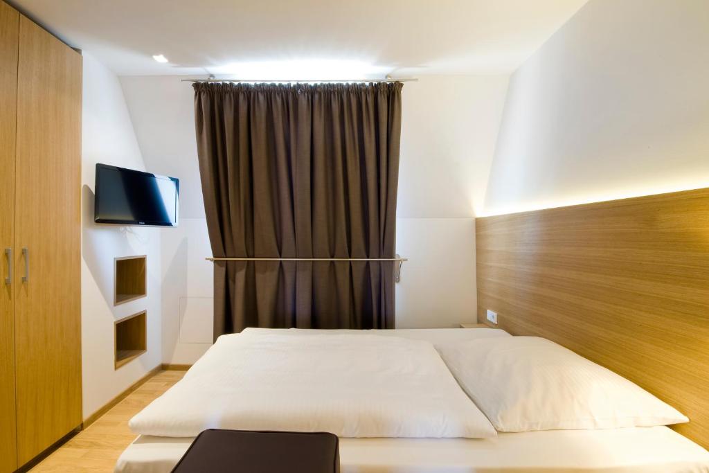 Postel nebo postele na pokoji v ubytování Hotel Thalmair