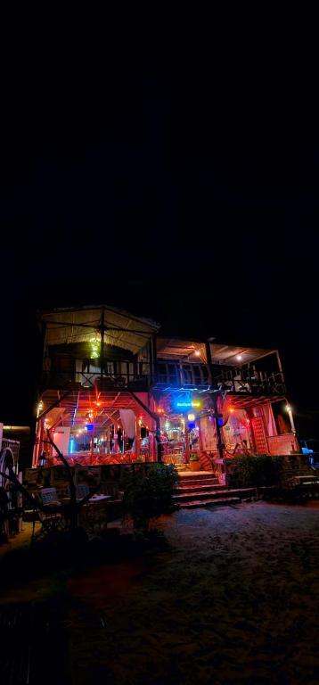 a building with colorful lights on it at night at Salah boutique camp in Nuweiba