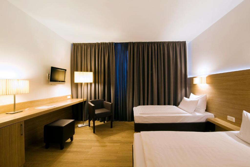 Postel nebo postele na pokoji v ubytování Hotel Thalmair