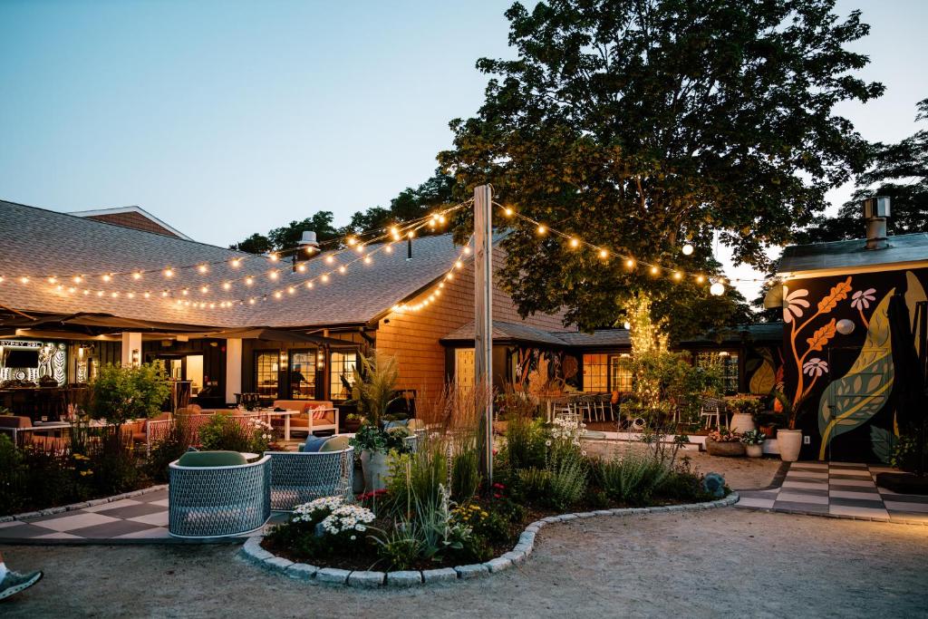 a building with a string of lights on it at UNCOMMONER HOTEL by Reverie Boutique Collection in West Yarmouth