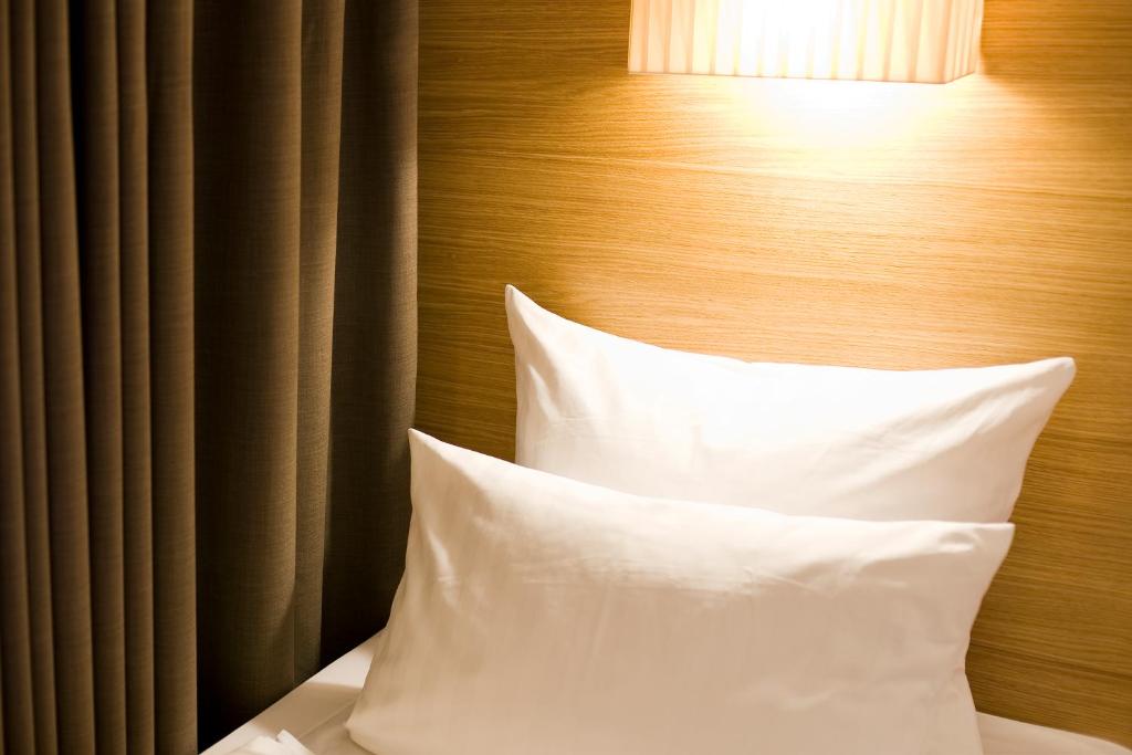 Postel nebo postele na pokoji v ubytování Hotel Thalmair