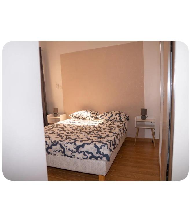 a bedroom with a bed and a side table at Dakar center studio house in Dakar