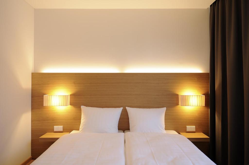 Postel nebo postele na pokoji v ubytování Hotel Thalmair