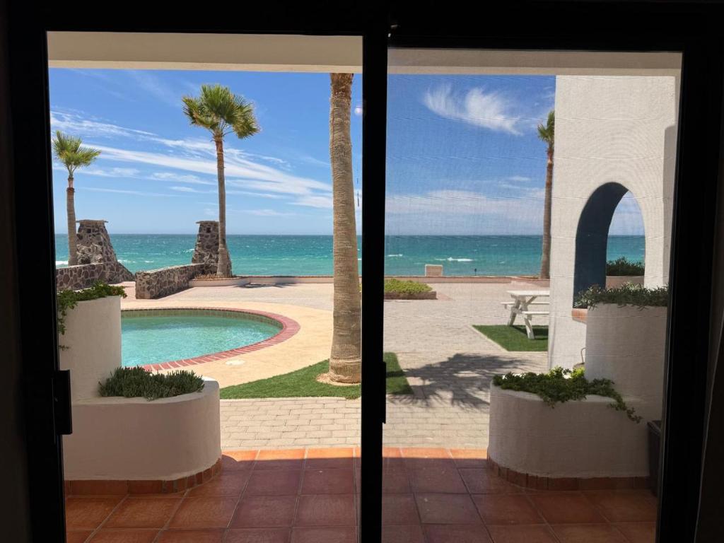 a view of the ocean from a resort with a swimming pool at Paradise Villa #5 in Puerto Peñasco