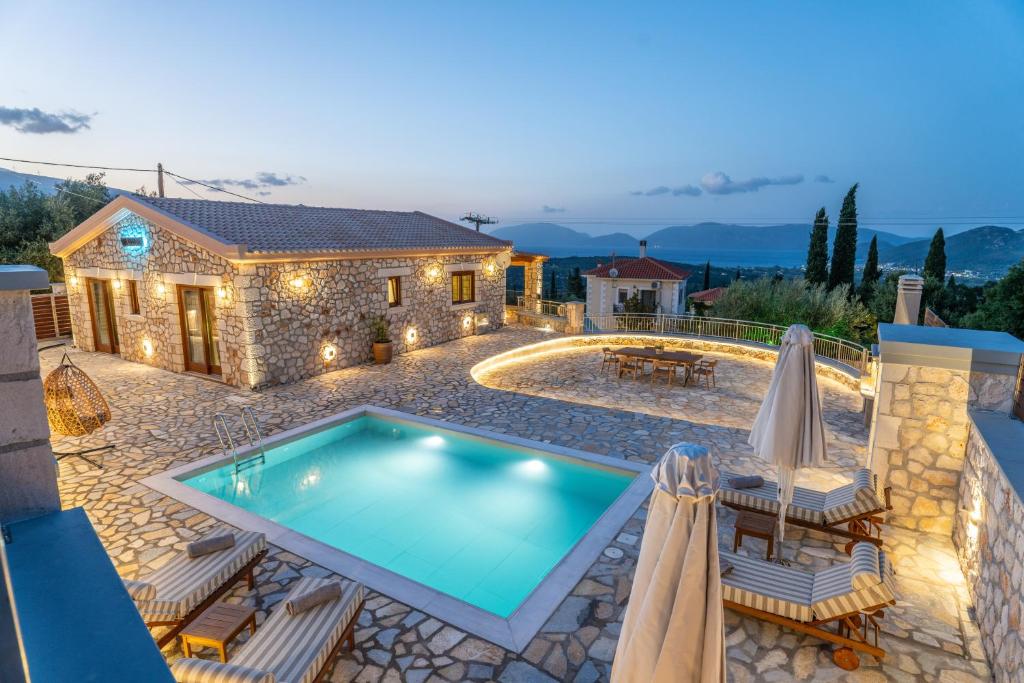 a villa with a swimming pool and a house at Villa Amantia in Chaliotata