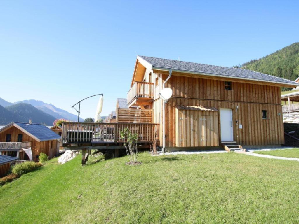 a house with a large yard in front of it at Wolkenheim in Hohentauern