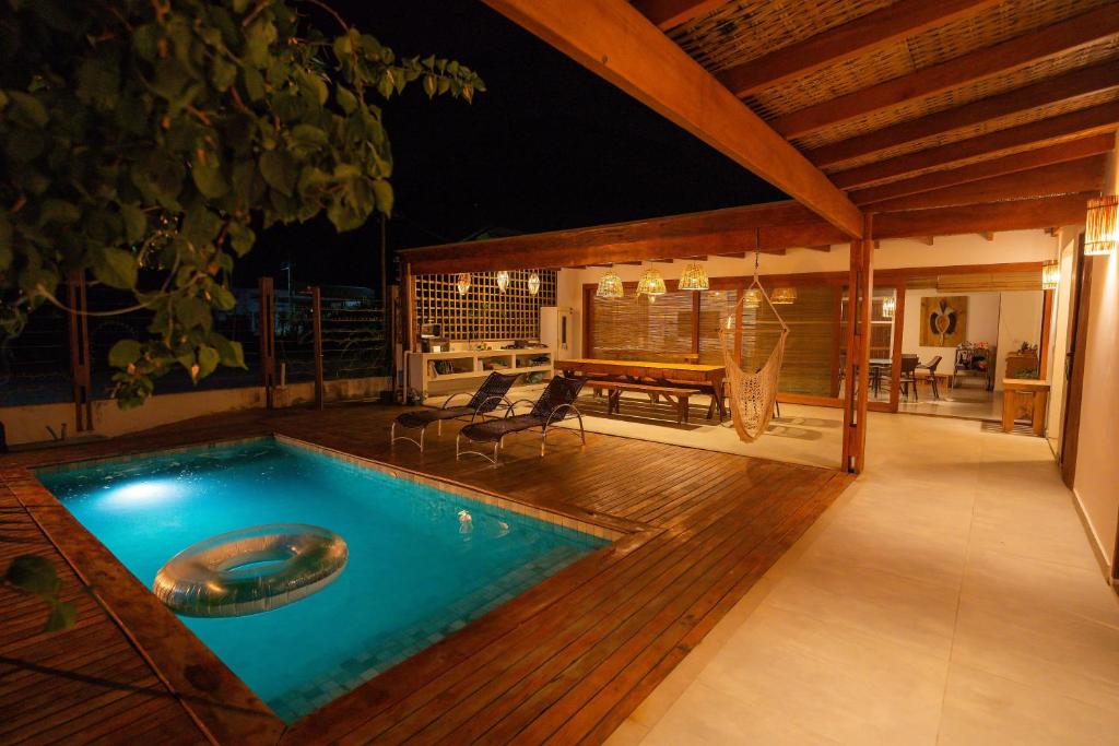 a swimming pool in the middle of a house at Casa Orybá in Prado