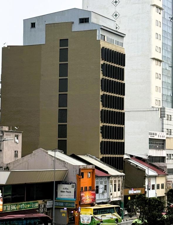 a tall building in the middle of a city at Hotel La ISRA at Kuala Lumpur in Kuala Lumpur