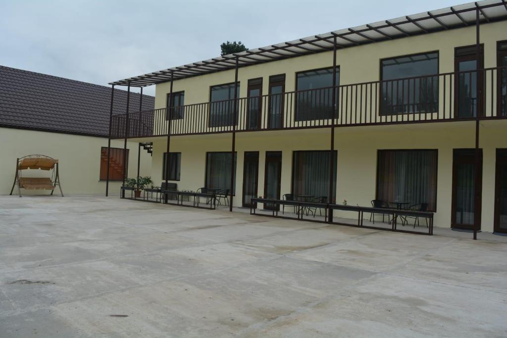 a building with benches on the side of it at Amaras Boutique Hotel Lori in Stepʼanavan