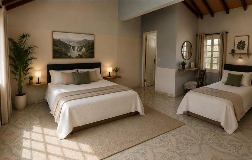 a large bedroom with two beds and a mirror at Cómo en casa CDE in Ciudad del Este