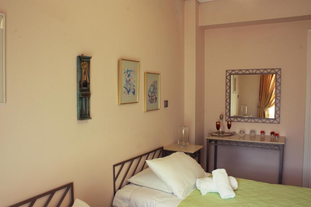 A bed or beds in a room at Veggie Garden Athens B&B