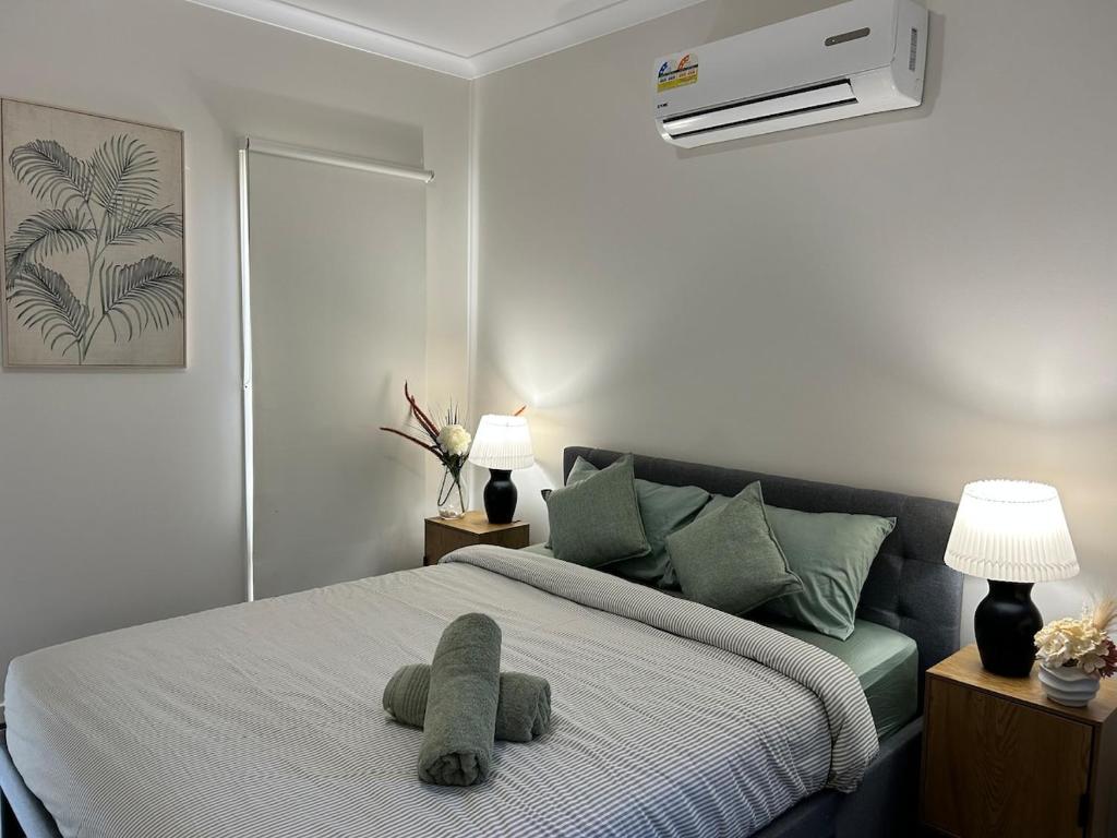 a bedroom with a bed with a stuffed animal on it at NatureWalkBrookfield in Melton South