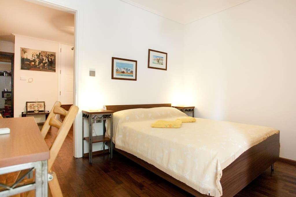 A bed or beds in a room at Veggie Garden Athens B&B