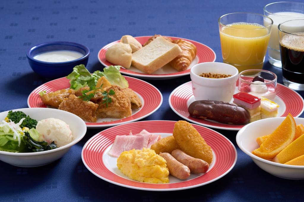 a group of plates of food on a table at Hotel Hokke Club Hakodate in Hakodate