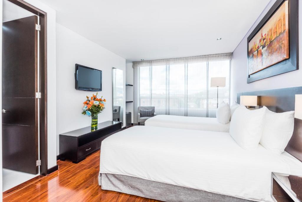 Postel nebo postele na pokoji v ubytování One Sixteen Hotel