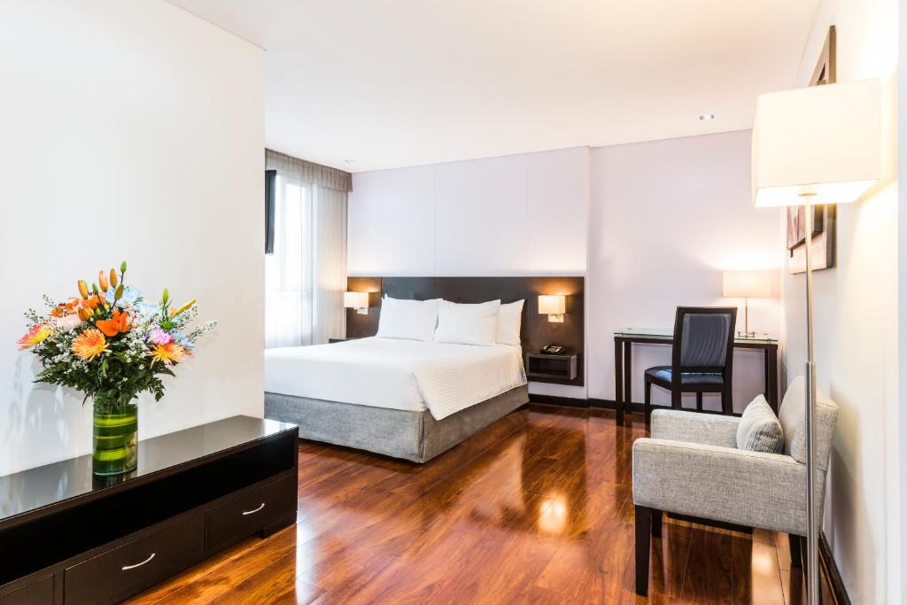 Postel nebo postele na pokoji v ubytování One Sixteen Hotel
