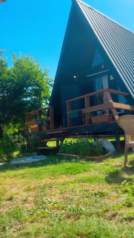 a house with a bench in front of it at Nino's cottage in Sighnaghi