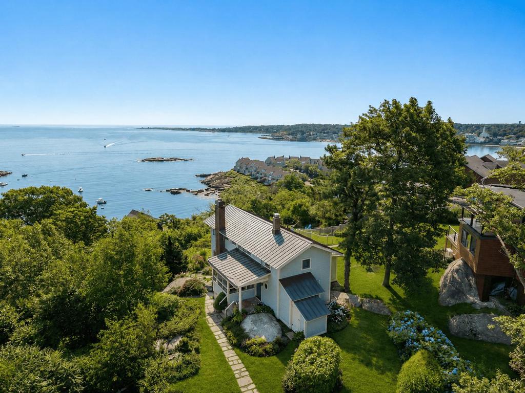 an aerial view of a house with a view of the water at Vista Mare in Rockport