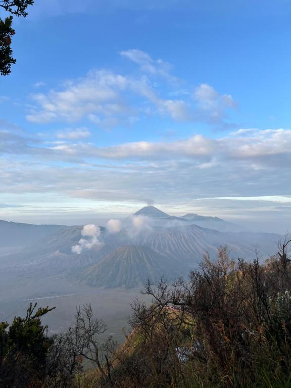 a view of a mountain in the sky with clouds at The Valley Guesthouse in Malang