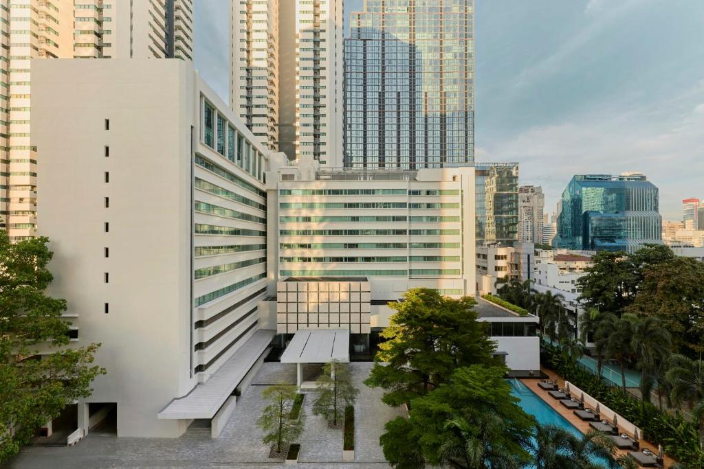 a view of a building in a city with tall buildings at COMO Metropolitan Bangkok in Bangkok