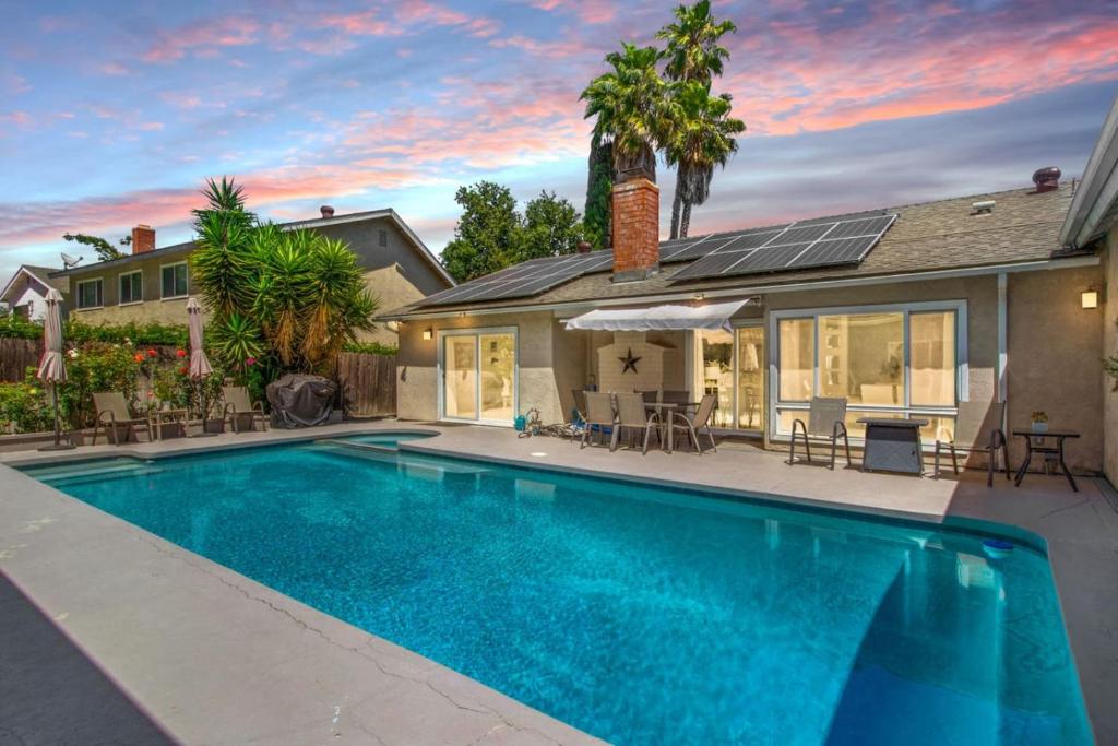 a swimming pool in front of a house at NEW Relax & Explore from MissionViejo | Pool | Spa in Mission Viejo
