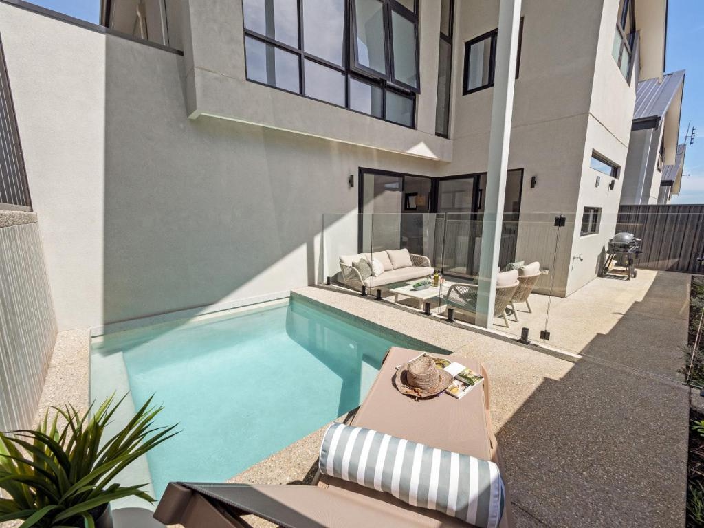 a swimming pool in the backyard of a house at Stone River Villa 2 - Private Escape - Heated Pool in Margaret River Town