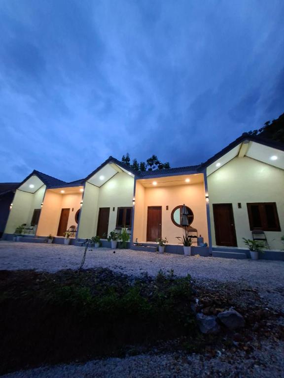 a row of houses at night at Sokmoungkhoun in Nongkhiaw