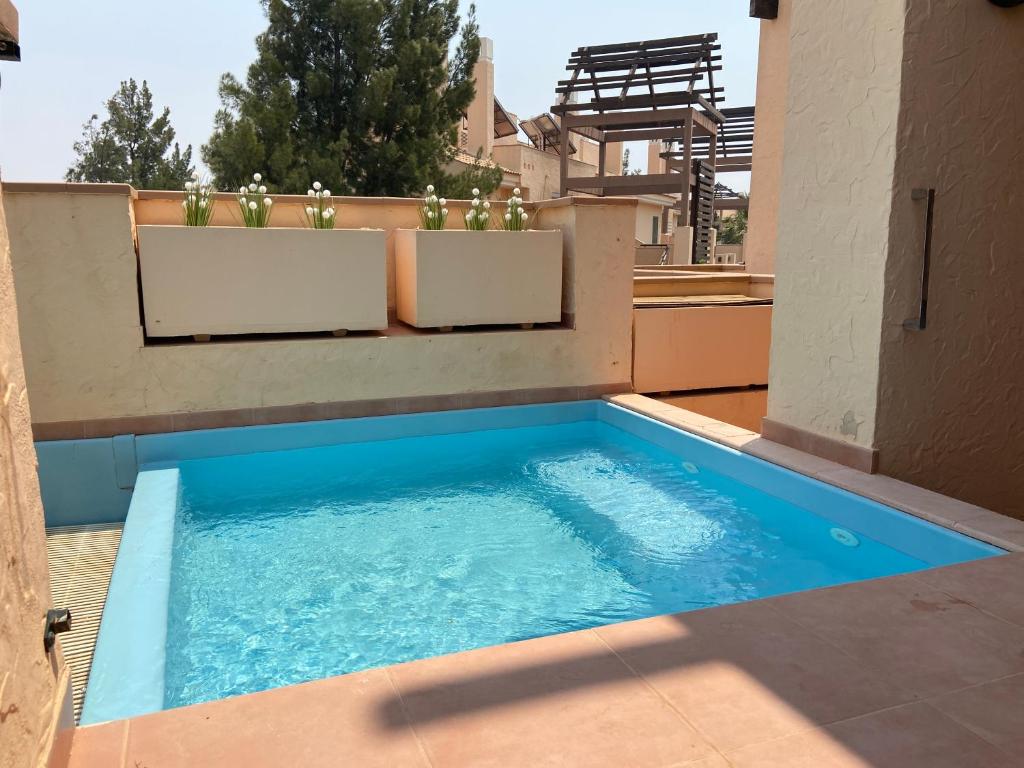 a swimming pool on the roof of a house at Casa Corner- Bonito Apartamento con mini piscina en Hacienda del Alamo in Escobar