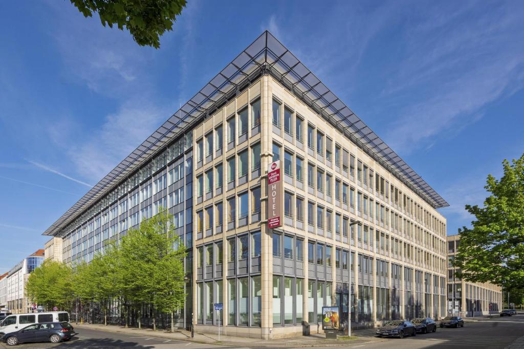 a large building with a lot of windows at Best Western Plus Hotel Dresden City in Dresden