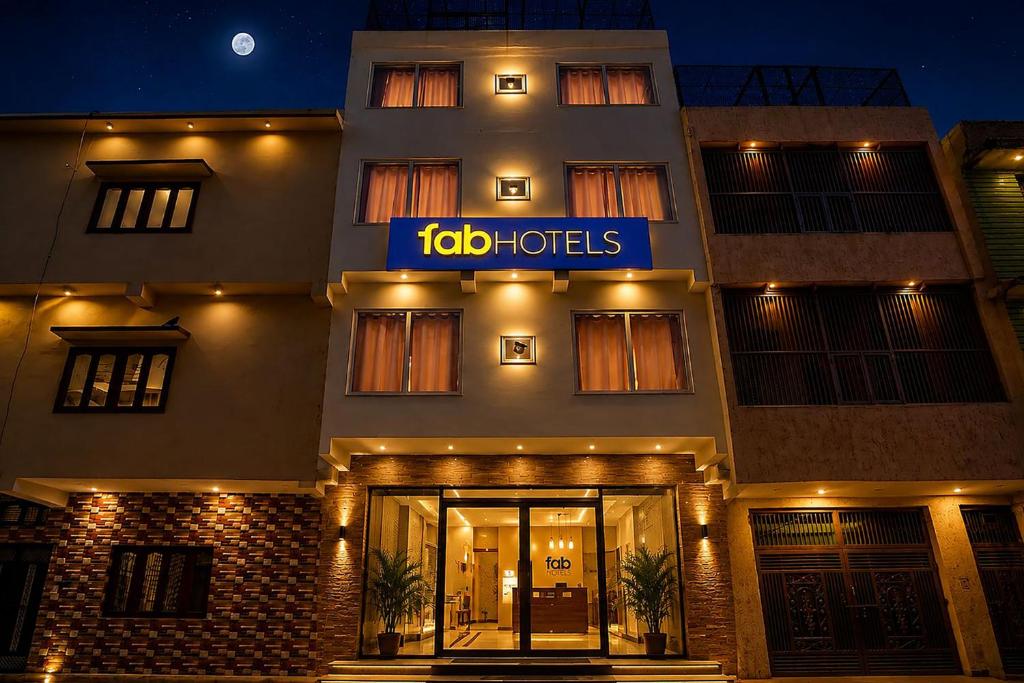a building with a sign on the front of it at FabHotel Shivangan in Vrindāvan